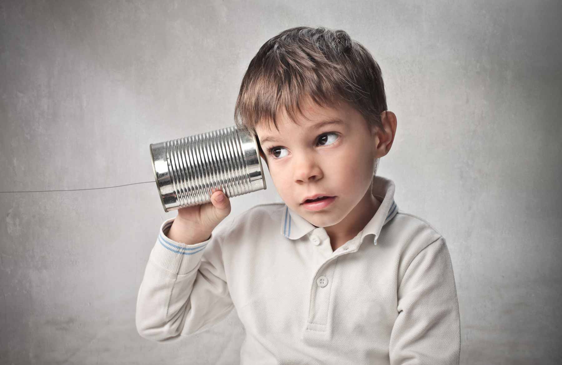 Photo of a young boy listening